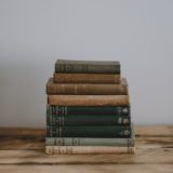 pile of Bible on brown surface