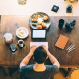 man typing on keyboard inside room
